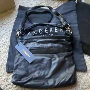 Wanderers travel Co. Black Athens grande leather purse. Brand new